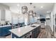 Beautiful kitchen featuring a large island with a sink, pendant lighting, and stainless steel appliances at 5490 Bent Grass Way, Douglasville, GA 30135