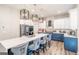 A kitchen featuring a large island with seating, modern appliances, and stylish cabinets at 5490 Bent Grass Way, Douglasville, GA 30135