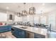 Modern kitchen with stainless steel appliances, large island, and stylish lighting at 5490 Bent Grass Way, Douglasville, GA 30135