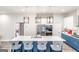 A kitchen featuring a large island with seating, stainless steel appliances, and stylish cabinets at 5490 Bent Grass Way, Douglasville, GA 30135