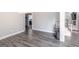 Bright living room showing contemporary finishes, and adjacent staircase at 5490 Bent Grass Way, Douglasville, GA 30135