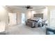 Spacious main bedroom with neutral tones, a ceiling fan and plush carpet at 5490 Bent Grass Way, Douglasville, GA 30135