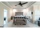 The main bedroom offers a stylish bed, a ceiling fan, and ample natural light at 5490 Bent Grass Way, Douglasville, GA 30135