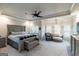Spacious main bedroom with a king bed, sitting area, and tray ceiling offering ample space at 5490 Bent Grass Way, Douglasville, GA 30135