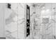 Luxurious shower with multi-jet system and marble-tiled walls at 5490 Bent Grass Way, Douglasville, GA 30135