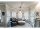 Cozy sitting area with arm chair and chaise lounge complemented by ample natural light at 5490 Bent Grass Way, Douglasville, GA 30135