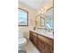 Well-lit bathroom with a white sink, vanity, and a large framed mirror at 55 Helen Ln, Stockbridge, GA 30281