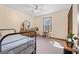 Bright bedroom features carpet, and a large window, with great natural lighting at 55 Helen Ln, Stockbridge, GA 30281