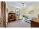 Bright bedroom featuring carpet, a desk, and sofa, with great natural lighting at 55 Helen Ln, Stockbridge, GA 30281