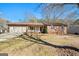 Charming brick home featuring an attached two-car garage and a well-maintained front yard at 55 Helen Ln, Stockbridge, GA 30281