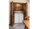 A laundry closet with a washer and dryer, featuring bi-fold doors and upper cabinets at 55 Helen Ln, Stockbridge, GA 30281