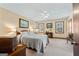 Spacious main bedroom with neutral tones, a ceiling fan, and bright natural light at 55 Helen Ln, Stockbridge, GA 30281