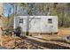 Exterior view of an outbuilding/shed with corrugated metal siding and a single door, providing storage space at 55 Helen Ln, Stockbridge, GA 30281