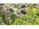 Overhead view of a landscaped property featuring a home with a deck, patio, and a lush green backyard at 1112 Haver Ct, Mcdonough, GA 30252