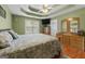 An airy primary bedroom featuring tray ceilings, wood floors and lots of natural light at 1112 Haver Ct, Mcdonough, GA 30252