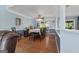 Open dining room featuring hardwood floors, blue accent wall, and large windows for natural light at 1112 Haver Ct, Mcdonough, GA 30252