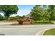 Pleasant Grove: inviting brick entrance to this community, lush landscaping, and verdant trees, promising a serene and welcoming neighborhood at 1112 Haver Ct, Mcdonough, GA 30252