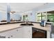 Kitchen sink area with tile backsplash, stainless appliances and an open view to the breakfast and deck at 1112 Haver Ct, Mcdonough, GA 30252