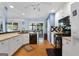 Bright eat-in kitchen with white cabinets, stainless appliances and an open layout to outdoor living at 1112 Haver Ct, Mcdonough, GA 30252