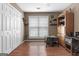 Office space featuring wood flooring, natural light, closet space and built-in shelving at 1112 Haver Ct, Mcdonough, GA 30252