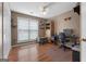Office space featuring wood flooring, natural light, a ceiling fan and closet space at 1112 Haver Ct, Mcdonough, GA 30252
