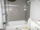 Modern bathroom with gray tiled walls and well-organized fixtures at 1876 Sw Sandtown Sw Rd, Atlanta, GA 30311