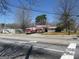 Two bright red fire engines are parked outside a City of Smyrna fire station on a clear, sunny day at 1876 Sw Sandtown Sw Rd, Atlanta, GA 30311