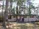 Charming single-story home with a welcoming front porch and classic architectural details at 1876 Sw Sandtown Sw Rd, Atlanta, GA 30311