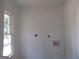 A utility room is ready with washer-dryer hookups and a window at 1876 Sw Sandtown Sw Rd, Atlanta, GA 30311