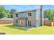 Exterior view of the home's rear facade highlighting the backyard and well-maintained lawn at 548 Thomas Downs Way, Jonesboro, GA 30238