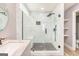 Modern bathroom with tiled walk-in shower, glass doors and a designer vanity at 548 Thomas Downs Way, Jonesboro, GA 30238