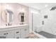 Stylish bathroom featuring double sinks, designer vanity, and tiled walk-in shower at 548 Thomas Downs Way, Jonesboro, GA 30238