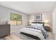 Cozy bedroom with a large window, soft gray tones, and comfortable furnishings at 548 Thomas Downs Way, Jonesboro, GA 30238