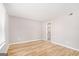 Spacious bedroom offering wood-look flooring and an attached bathroom at 548 Thomas Downs Way, Jonesboro, GA 30238