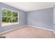 This bedroom has a bright window and light-colored carpet, perfect for relaxation at 548 Thomas Downs Way, Jonesboro, GA 30238