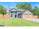 Charming two-story home features a spacious two-car garage and beautifully maintained lawn at 548 Thomas Downs Way, Jonesboro, GA 30238