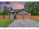 Charming two-story home features a spacious two-car garage and beautifully maintained lawn at 548 Thomas Downs Way, Jonesboro, GA 30238