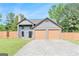 Charming two-story home features a spacious two-car garage and beautifully maintained lawn at 548 Thomas Downs Way, Jonesboro, GA 30238