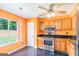 Updated kitchen offering stainless steel appliances, sleek dark countertops, and a bright atmosphere at 548 Thomas Downs Way, Jonesboro, GA 30238