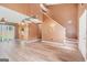 Open living room with modern floors, a staircase, and abundant natural light at 548 Thomas Downs Way, Jonesboro, GA 30238