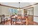 Inviting dining room with wood floors, natural light, view to living room fireplace at 175 Laney Ct, Mcdonough, GA 30252