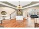 Spacious living room with hardwood floors, elegant decor, and open floor plan at 204 Carmell Ct, Mcdonough, GA 30252