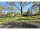 Large backyard showcasing mature trees, and a grassy area at 758 King Rd, Jonesboro, GA 30236