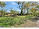 Expansive backyard featuring mature trees and a lush lawn at 758 King Rd, Jonesboro, GA 30236