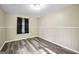Neutral bedroom with wood-look floors and ample natural light at 758 King Rd, Jonesboro, GA 30236