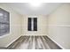 Bedroom with wood-look floors, neutral walls, and natural light at 758 King Rd, Jonesboro, GA 30236