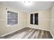 Bedroom with wood-look floors, neutral walls, and natural light at 758 King Rd, Jonesboro, GA 30236