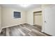 Bedroom with wood-look floors, closet, and neutral paint at 758 King Rd, Jonesboro, GA 30236