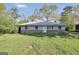 Charming single-story home with a well-maintained lawn and inviting curb appeal during daytime at 758 King Rd, Jonesboro, GA 30236