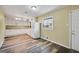 Bright kitchen featuring white cabinets, granite countertops, and modern appliances at 758 King Rd, Jonesboro, GA 30236